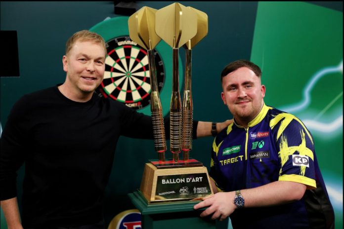 Paddy-Power-darts Luke Littler and Chris Hoy pictured holding a darts trophy