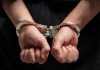 Alleged casino fraud kingpin extradited to China Close up of hands in handcuffs
