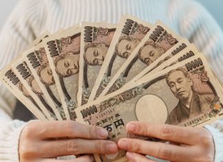 Japan regulator ramps up spending ahead of casino transformation Woman fans out Japanese Yen
