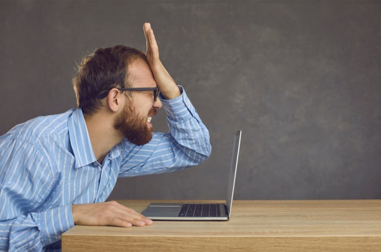 How a legal blunder led to tax exemption for Estonian casinos Man exasperated in front of laptop