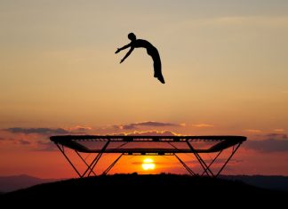 Sports betting bounces back in Denmark silhouette of trampolinist