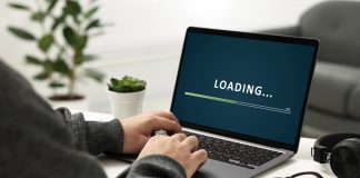 Virginia iGaming legislation progresses through committees Loading bar on laptop