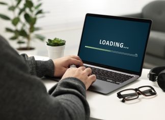 Virginia iGaming legislation progresses through committees Loading bar on laptop