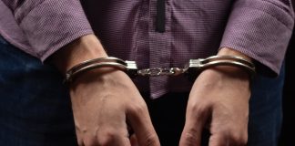 Arrests reveal stark details of Cambodia casino scam centres Man in handcuffs