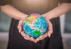 Swintt boosts global reach with SkillOnNet link-up Woman holding globe