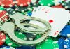 Greece makes players criminally liable in black market crackdown Cards and handcuffs, signalling criminality