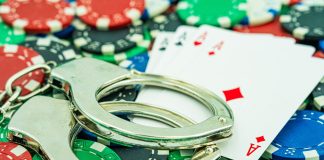 Greece makes players criminally liable in black market crackdown Cards and handcuffs, signalling criminality