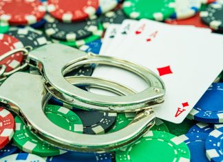 Greece makes players criminally liable in black market crackdown Cards and handcuffs, signalling criminality