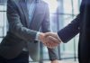 Elantil secures live casino boost with Animo link-up Businessmen shake hands
