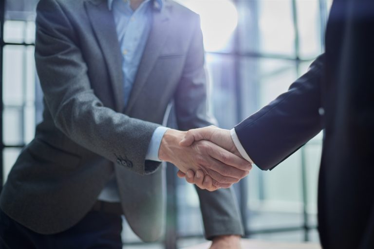 Businessmen shake hands