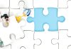 Why iGaming operators are rethinking aggregation with Infingame People fit a puzzle piece in its place, illustrating Infingame's integration work.