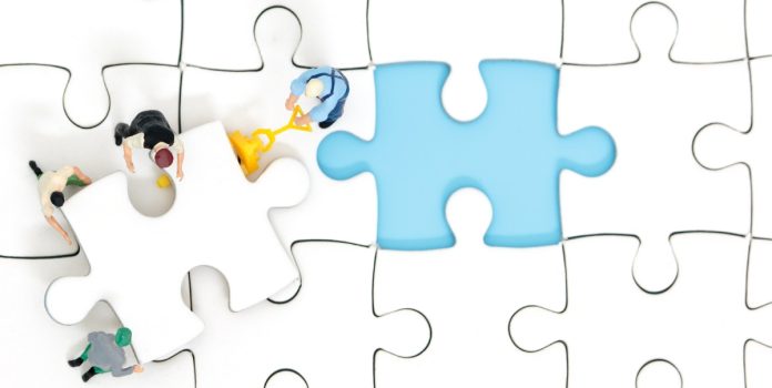 infingame People fit a puzzle piece in its place, illustrating Infingame's integration work.