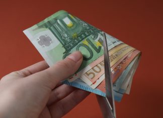 Advertising spending slashed as Kenya faces taxation crossroads Scissors cut through money