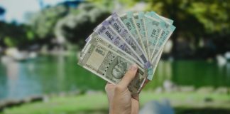 Goa eyes financial boost via major casino fee hike Hand holding Indian rupees