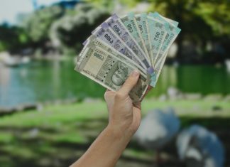 Goa eyes financial boost via major casino fee hike Hand holding Indian rupees