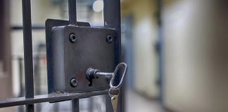 Egypt includes life sentences in cybercrime law changes Key in the lock of a jail cell