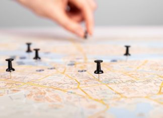 Soft2Bet lays out Alberta roadmap ahead of expansion Hand putting pins in a roadmap