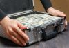 Who will stump up $2bn for Codere? Money stacked in a briefcase