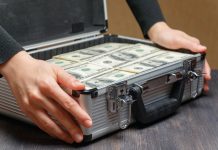 Who will stump up $2bn for Codere? Money stacked in a briefcase
