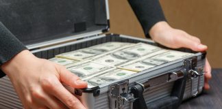 Who will stump up $2bn for Codere? Money stacked in a briefcase