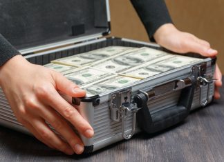 Who will stump up $2bn for Codere? Money stacked in a briefcase