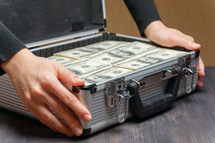 Codere analysis Money stacked in a briefcase