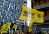 Amnesty International demands investigation into casino abuse in Cambodia Amnesty International flag at a protest