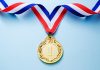 Infingame: cementing a leadership position in casino aggregation Gold Medal on blue background