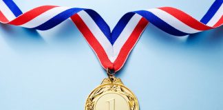 Infingame: cementing a leadership position in casino aggregation Gold Medal on blue background