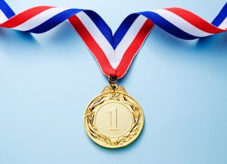 Infingame: cementing a leadership position in casino aggregation Gold Medal on blue background