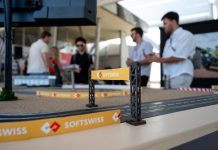 SOFTSWISS reaps early rewards of referral system SOFTSWISS branding on a scalextric track