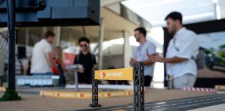 SOFTSWISS reaps early rewards of referral system SOFTSWISS branding on a scalextric track