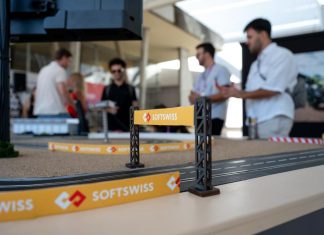 SOFTSWISS reaps early rewards of referral system SOFTSWISS branding on a scalextric track