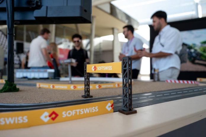 SOFTSWISSS referral system SOFTSWISS branding on a scalextric track