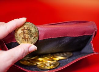 ReferOn steps up crypto capabilities with new payments layer Hand holds a gold coin with bitcoin logo
