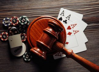 How a vast illegal gambling network overwhelmed a court in Southern Africa Gavel with cards and poker chips