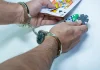 ‘To save youth from destruction’, Bangladesh vows no leniency for illegal gambling Man in handcuffs holds out cards and poker chips