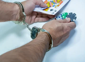 ‘To save youth from destruction’, Bangladesh vows no leniency for illegal gambling Man in handcuffs holds out cards and poker chips