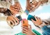 Ygam warns students increasingly being influenced by social media gambling Students looking at phones