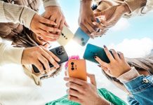 Ygam warns students increasingly being influenced by social media gambling Students looking at phones
