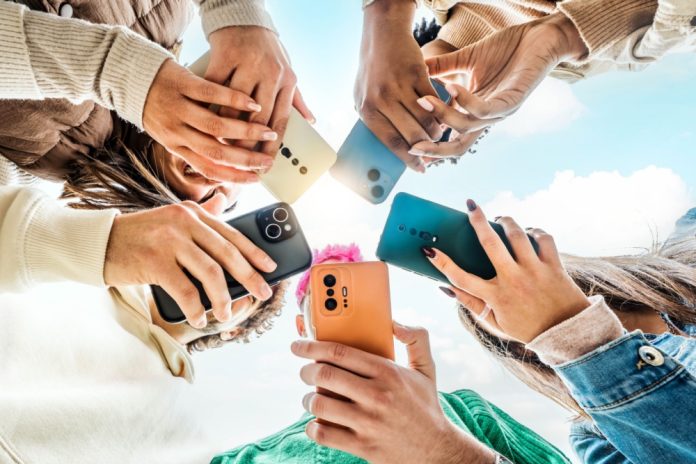Ygam study Students looking at phones