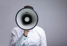 Gambling Commission ‘increasingly vocal’ against companies failing in black market fight Close up of a man shouting through a megaphone
