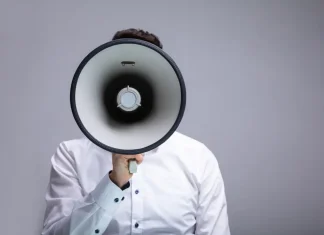 Gambling Commission ‘increasingly vocal’ against companies failing in black market fight Close up of a man shouting through a megaphone