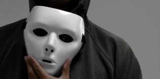 MGA battles back against false licensing claims Man holdimg white mask