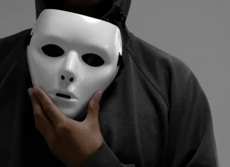MGA battles back against false licensing claims Man holdimg white mask