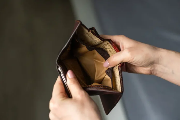 Hand opening an empty wallet