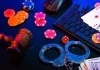 Is illegal gambling moving away from Cambodia amid government crackdown? Handcuffs and poker chips