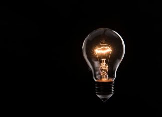 EdgeLabs: We Don’t Gamble on Growth. We Innovate It. lightbulb on black background
