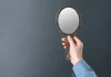 BET99: affiliate playbook in Alberta should mirror Ontario Woman holding up mirror