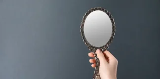 BET99: affiliate playbook in Alberta should mirror Ontario Woman holding up mirror